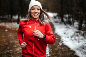 woman in red jacket running 